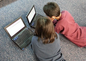 Young children on laptops